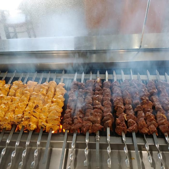 Party Pack #4 - 25 Skewers w/ 2 Large Sides & 1 Medium tray of Greek Salad or Fattoush Salad.